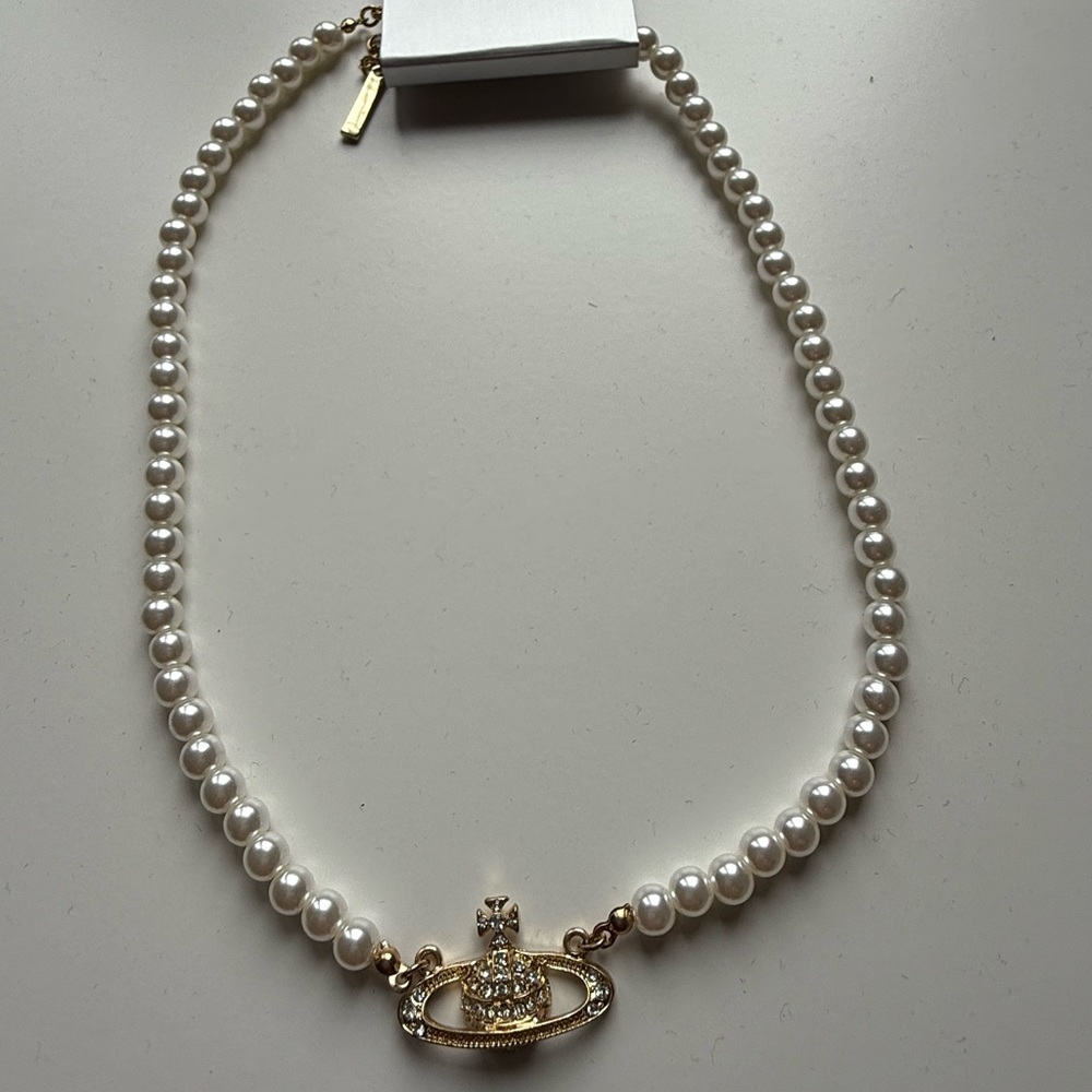 Lustrous Pearl Necklace with Ornate Gold Centerpiece